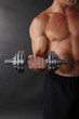 © Africa Studio - Muscle young sportsman execute exercise with dumbbell