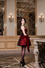Portrait Of A Woman In Red Cocktail Dress In Luxury Interior