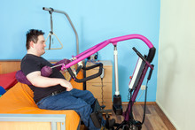 Patient With Cerebral Palsy Using A Patient Lift.