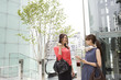 © Monet - Young woman talking in the office building