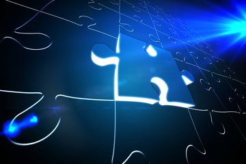 Poster - Blue glowing jigsaw piece on puzzle