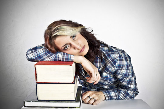 Girl bored by reading dictionaries