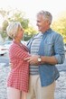 © WavebreakmediaMicro - Happy mature couple hugging in the city
