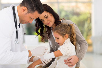 Wall Mural - medical doctor bandaging patient