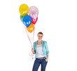 © Wisiel - woman with balloons over white background smiling