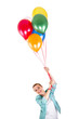 © Wisiel - woman with balloons over white background smiling