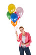 © Wisiel - woman with balloons over white background smiling