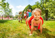 © Sergey Novikov - Cute group of kids play crawling in tube