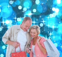 Poster - Composite image of couple with shopping bags and smartphone