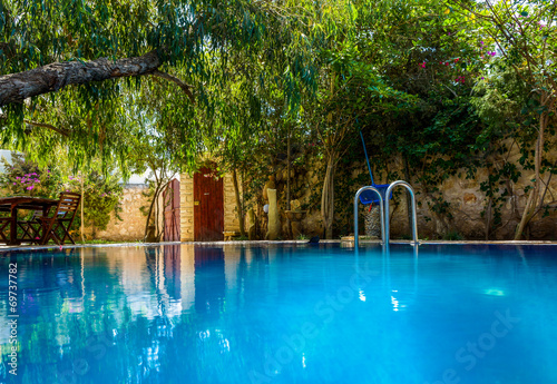 Big Blue Pool In The Middle Of Backyard Buy This Stock Photo And