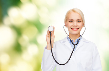 Poster - smiling female doctor with stethoscope