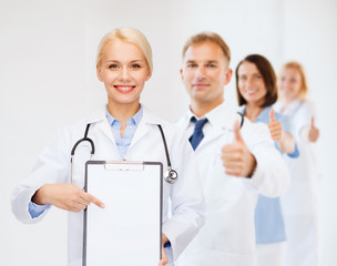 Sticker - smiling female doctor with clipboard