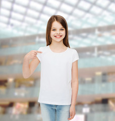 Canvas Print - smiling little girl in white blank t-shirt