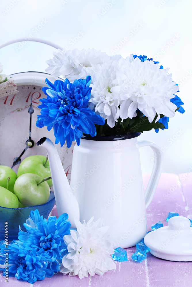 Composition of white and blue chrysanthemum and utensil
