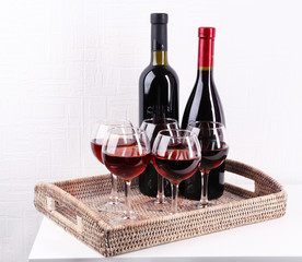 Poster - Glasses and wine bottle on tray in room