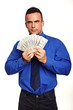 © petrdlouhy - Young man in blue shirt holds and shows you money