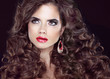 Beauty fashion girl. Wavy long hair. Brunette model with red lip