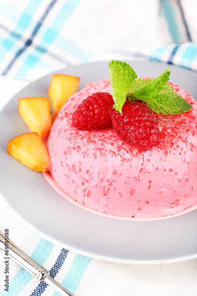 Heart shaped cake with fruits and berries on plate on