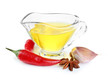 Homemade natural infused olive oil in glass sauce-boat with red
