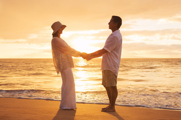 Wall Mural - Mature Couple Enjoying Sunset