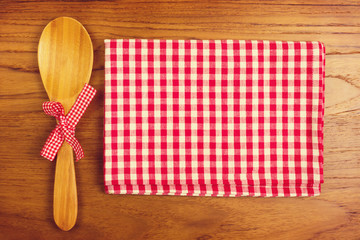 Wall Mural - Tablecloth and wooden spoon for cooking anf baking