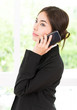 © siraphol - Business woman talking cellphone
