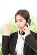 © siraphol - Business woman talking cellphone