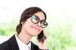 © siraphol - Business woman talking cellphone