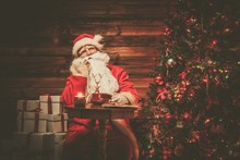 Santa Claus In Wooden Home Interior