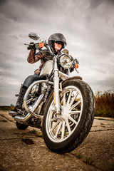 Wall Mural - Biker girl on a motorcycle