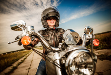 Wall Mural - Biker girl on a motorcycle