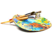 Art Palette With Paint And A Brush On White Background