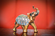 Golden indian elephant on table. Decorative elephant statue
