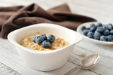 Fototapeta Mapy - Porridge with fresh blueberry