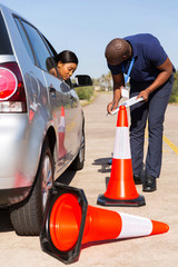 Poster - female black learner driver made a mistake when reverse