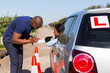 © michaeljung - male african driving instructor and student driver