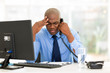 © michaeljung - stressed businessman talking on landline phone