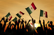 Silhouettes of People Holding Flag of Mexico