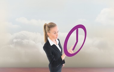 Poster - Composite image of businesswoman pointing