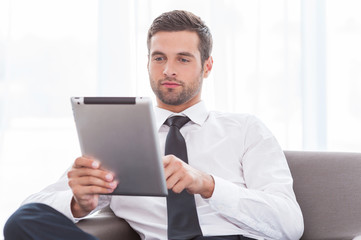 Poster - Examining his new tablet.