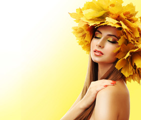 Wall Mural - Beautiful young woman with yellow autumn wreath