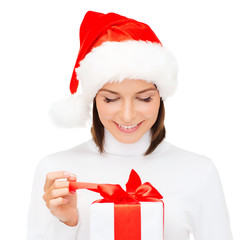 Sticker - smiling woman in santa helper hat with gift box