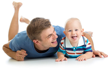 Wall Mural - happy father and baby son having fun pastime