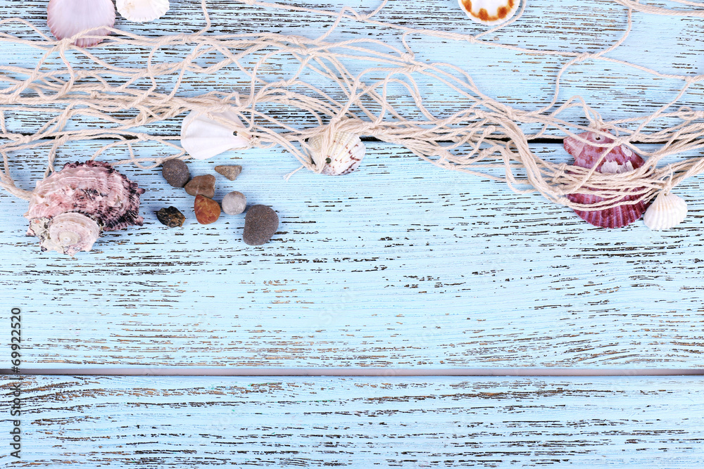 Decor of seashells close-up on blue wooden table