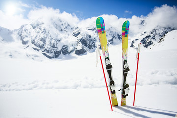 Fototapete - Skiing , mountains and ski equipments on ski run