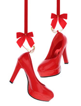 High Heels Shoes Hanging On Red Ribbon Isolated On White