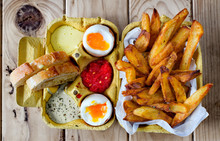 Two Soft Boiled Eggs With Fries And Sauces.