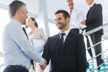 Sticker - Businessmen shaking hands.