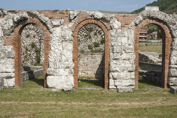 Poster - roman ruins, triple arch near italian village of gubbio.