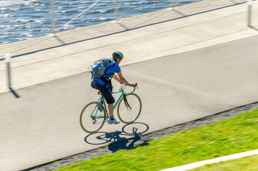 Commuter Riding a Bike on a Cycle Path